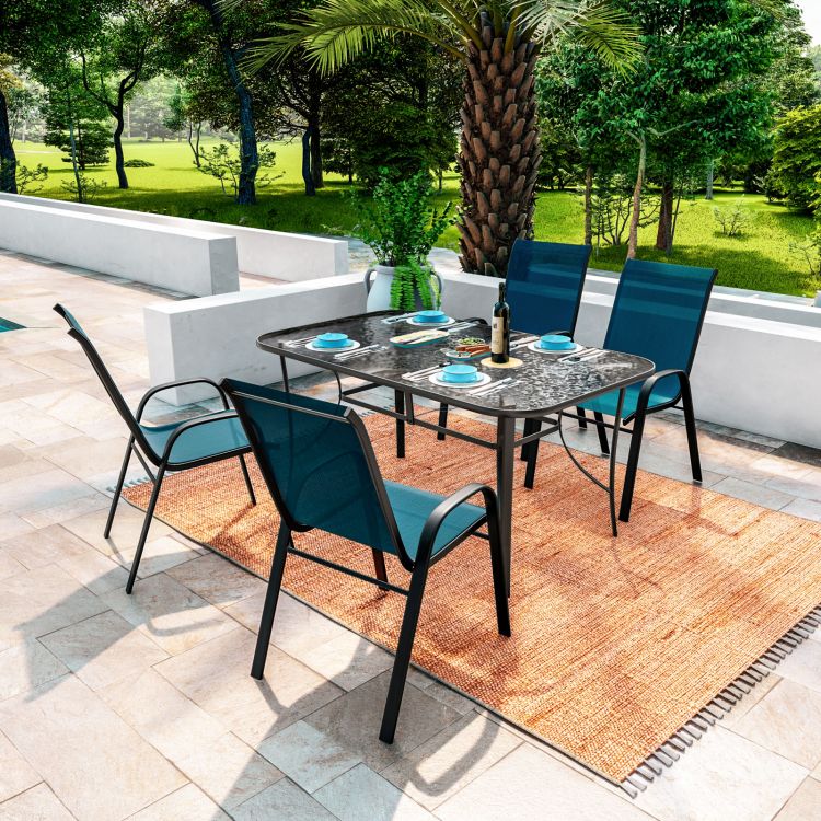 Set pranzo con tavolo 150x90 cm top trasparente e 4 sedie in acciaio e textilene blu marino